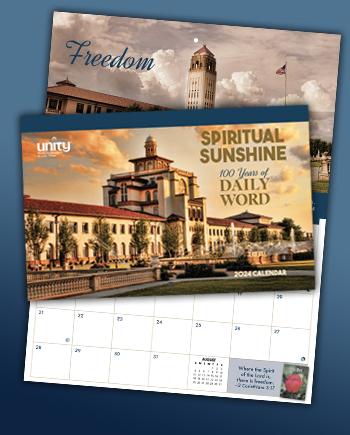 Spiritual Sunshine: 100 Years of Daily Word—2024 Unity Calendar over an image of Unity Village at sunset with light clouds floating by and the fountains creating a peaceful ambience 